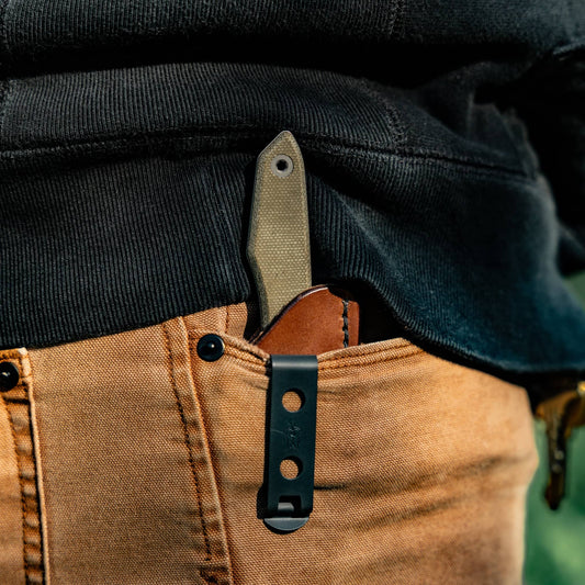 Pocket carry: Lookout fixed-blade knife in a brown leather sheath clipped inside a pants pocket