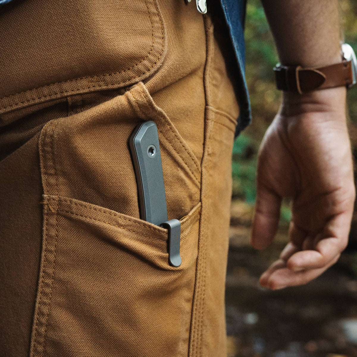 Titanium-handled Cloudland knife carried in a sheath inside a pants pocket