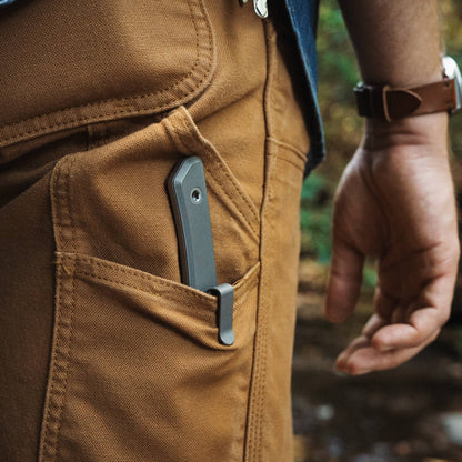 Titanium-handled Cloudland knife carried in a sheath inside a pants pocket